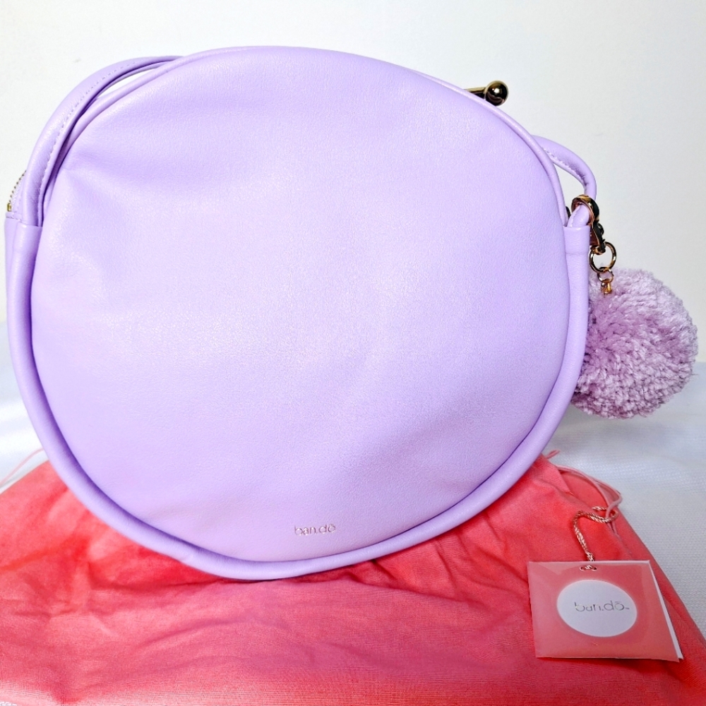 Ban.do brand "Pastels and Pom-poms" 100%leather lavender crossbody purse.
